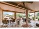 Inviting covered patio featuring comfortable seating, perfect for outdoor relaxation and entertaining at 20450 N Shadow Mountain Dr, Surprise, AZ 85374