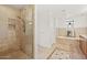 Bathroom featuring a modern walk-in shower and a luxurious soaking tub at 2402 E Esplanade Ln # 204, Phoenix, AZ 85016