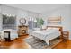 Spacious bedroom with a fireplace, large windows, and cozy seating area at 2402 E Esplanade Ln # 204, Phoenix, AZ 85016