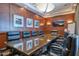Upscale conference room features a long granite table, executive chairs, and wood paneled walls at 2402 E Esplanade Ln # 204, Phoenix, AZ 85016