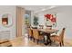 Elegant dining area with modern table, seating for six, and stylish decor at 2402 E Esplanade Ln # 204, Phoenix, AZ 85016