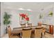 Modern dining room with a long table and artistic decor at 2402 E Esplanade Ln # 204, Phoenix, AZ 85016