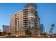 Luxury high-rise apartment building at twilight features expansive balconies at 2402 E Esplanade Ln # 204, Phoenix, AZ 85016