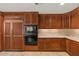 Spacious kitchen featuring stainless steel appliances, wood cabinets, and stone countertops at 2402 E Esplanade Ln # 204, Phoenix, AZ 85016