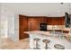 Spacious kitchen with custom cabinetry, marble countertops, and stainless steel appliances at 2402 E Esplanade Ln # 204, Phoenix, AZ 85016