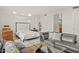Open concept living room and bedroom with modern furnishings and decor at 2402 E Esplanade Ln # 204, Phoenix, AZ 85016