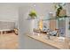 Bright living room with glass shelving, travertine floors and views of outdoor space at 2402 E Esplanade Ln # 204, Phoenix, AZ 85016