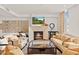 Cozy living room with fireplace, comfortable seating and a modern design at 2402 E Esplanade Ln # 204, Phoenix, AZ 85016