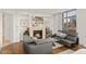 Contemporary living room featuring a fireplace, comfortable sofas and large window at 2402 E Esplanade Ln # 204, Phoenix, AZ 85016