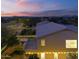 Twilight aerial view of the house shows backyard oasis and manicured desert landscape at 29228 N 48Th St, Cave Creek, AZ 85331