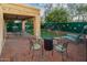 Spacious backyard featuring a putting green, outdoor seating, and a built-in grill perfect for entertaining guests at 29228 N 48Th St, Cave Creek, AZ 85331