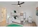 This bedroom features a bunkbed, bright lighting, and a doorway to a bathroom at 29228 N 48Th St, Cave Creek, AZ 85331