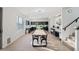 Open concept dining room with large dining table, modern chandelier, and stairs at 29228 N 48Th St, Cave Creek, AZ 85331