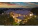 Stunning home exterior at dusk with a beautifully landscaped yard, cozy patio, and inviting outdoor lighting at 29228 N 48Th St, Cave Creek, AZ 85331