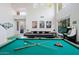 This spacious game room features a pool table, shuffleboard and vintage arcade games at 29228 N 48Th St, Cave Creek, AZ 85331