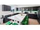 Modern kitchen with dark cabinets, stainless steel appliances, and a white island at 29228 N 48Th St, Cave Creek, AZ 85331