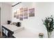 Coffee bar with a white countertop, dark cabinets, and modern artwork, perfect for brewing your favorite drinks at 29228 N 48Th St, Cave Creek, AZ 85331