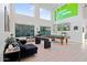 This living room has games, tall windows, and modern furnishings at 29228 N 48Th St, Cave Creek, AZ 85331