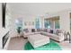 Bright living room with a fireplace, TV and a large sectional sofa at 29228 N 48Th St, Cave Creek, AZ 85331