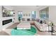 Bright living room with fireplace, a large TV and a sectional sofa at 29228 N 48Th St, Cave Creek, AZ 85331