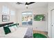 This main bedroom features a large window, a tv, and bright natural lighting at 29228 N 48Th St, Cave Creek, AZ 85331