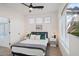 This main bedroom features two windows, a tv, and bright natural lighting at 29228 N 48Th St, Cave Creek, AZ 85331