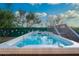 Sparkling in-ground pool featuring a sleek design and a wooden deck for lounging under the Arizona sun at 29228 N 48Th St, Cave Creek, AZ 85331