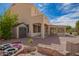 Backyard featuring covered patio, seating area, shed, desert landscaping, and custom brick work at 29399 N 67Th Ave, Peoria, AZ 85383