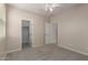 Bright bedroom featuring neutral walls, carpet flooring, ceiling fan, and closet space at 29399 N 67Th Ave, Peoria, AZ 85383