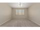 Neutral bedroom with large window that let's in plenty of sunlight and ceiling fan at 29399 N 67Th Ave, Peoria, AZ 85383