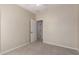 Bedroom featuring carpeted floors, neutral walls, ceiling fan, and entry to another room at 29399 N 67Th Ave, Peoria, AZ 85383