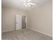 Bright bedroom featuring neutral walls, carpet flooring, and ceiling fan with light fixture at 29399 N 67Th Ave, Peoria, AZ 85383