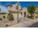 Two-story home with desert landscaping, tile roof, and a two-car garage at 29399 N 67Th Ave, Peoria, AZ 85383