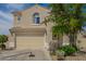 Two-story home with desert landscaping, tile roof, and a two-car garage at 29399 N 67Th Ave, Peoria, AZ 85383