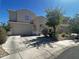 Charming two-story home with a desert-landscaped yard and a two-car garage under a clear blue sky at 29399 N 67Th Ave, Peoria, AZ 85383
