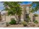 Two-story home with desert landscaping, tile roof, and a two-car garage at 29399 N 67Th Ave, Peoria, AZ 85383