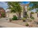 Two-story home with desert landscaping, tile roof, and a two-car garage at 29399 N 67Th Ave, Peoria, AZ 85383