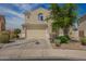 Two-story home with desert landscaping, tile roof, and a two-car garage at 29399 N 67Th Ave, Peoria, AZ 85383