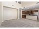 Open-concept living room and kitchen boast stainless steel appliances and ample counter space at 29399 N 67Th Ave, Peoria, AZ 85383