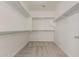 Walk-in closet with built in shelving and plenty of storage space at 29399 N 67Th Ave, Peoria, AZ 85383