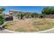 Expansive backyard featuring a pool, a covered patio, and ample green space, perfect for outdoor entertaining at 3067 E Trigger Way, Gilbert, AZ 85297