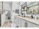 Modern bathroom with double sinks, granite countertops, and a walk-in shower at 3067 E Trigger Way, Gilbert, AZ 85297