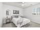 Bright bedroom with a full bed, gray carpet, and windows, creating a cozy and inviting space at 3067 E Trigger Way, Gilbert, AZ 85297