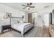 Spacious bedroom with modern furnishings, ensuite bathroom, and neutral color palette at 3067 E Trigger Way, Gilbert, AZ 85297