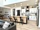 Modern kitchen with white cabinets, black accents, a large island, and stainless steel appliances at 3067 E Trigger Way, Gilbert, AZ 85297
