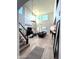 Bright living room with high ceilings, large windows, and views into other living spaces at 3067 E Trigger Way, Gilbert, AZ 85297