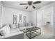 Cozy living room featuring a sectional sofa, coffee table, and neutral decor for comfortable living at 3067 E Trigger Way, Gilbert, AZ 85297