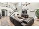 Spacious living room featuring high ceilings, a staircase, modern decor, and lots of natural light at 3067 E Trigger Way, Gilbert, AZ 85297