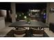 Elegant outdoor dining area with a table and chairs, perfect for al fresco meals and evening gatherings under the stars at 3067 E Trigger Way, Gilbert, AZ 85297