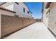 Spacious side yard with concrete and block fence, perfect for extra storage or outdoor activities at 3067 E Trigger Way, Gilbert, AZ 85297